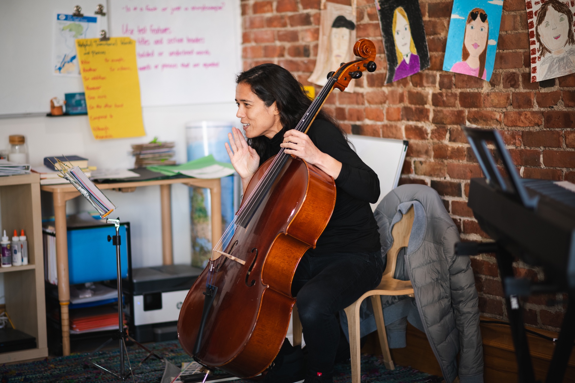 Paloma playing cello in the studio